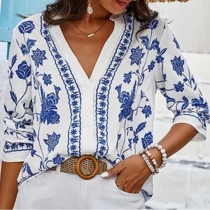 Floral print v neck loose fit long sleeve blouse.